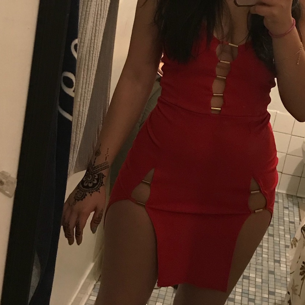 Red bodycon dress with gold metal bars